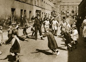 Children dancing to street music by English Photographer
